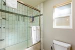 Tub and shower combo, beautiful tiled shower with shelf space for products